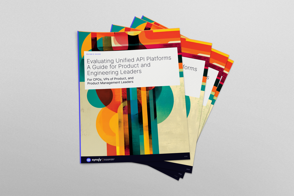 Stacked, colorful brochure covers featuring abstract art; front cover reads 'Evaluating Unified API Platforms: A Guide for Product and Engineering Leaders' (Buyer's Guide) with a Synqly logo at the bottom edge, 2026 edition.